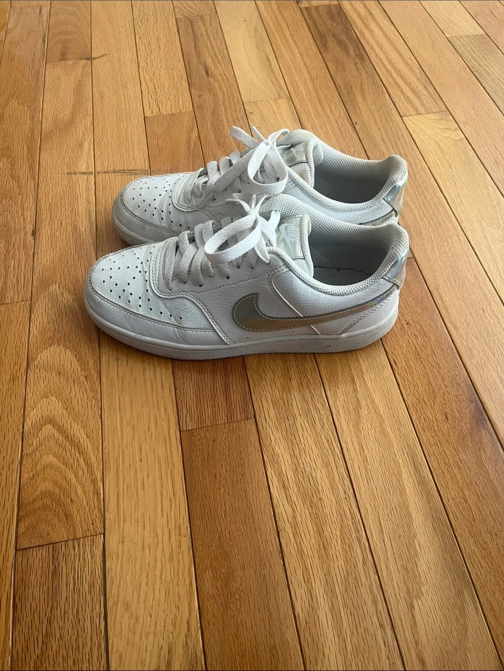 Nike White Low-Top Sneakers with Silver Swoosh Accent